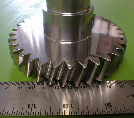 Gear and shaft with isotropic finish developed from centrifugal barrel finish operation